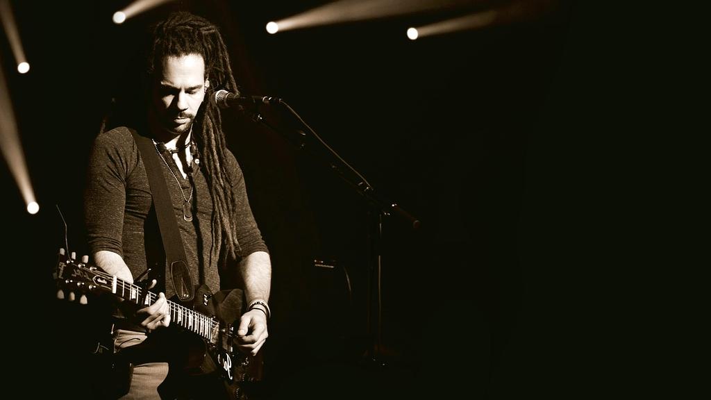 Concert stage with bright lights and crowd