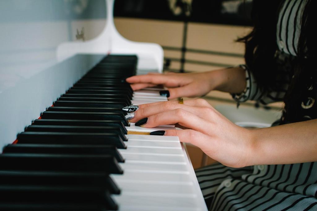 Jazz pianist Marcus Thompson at grand piano
