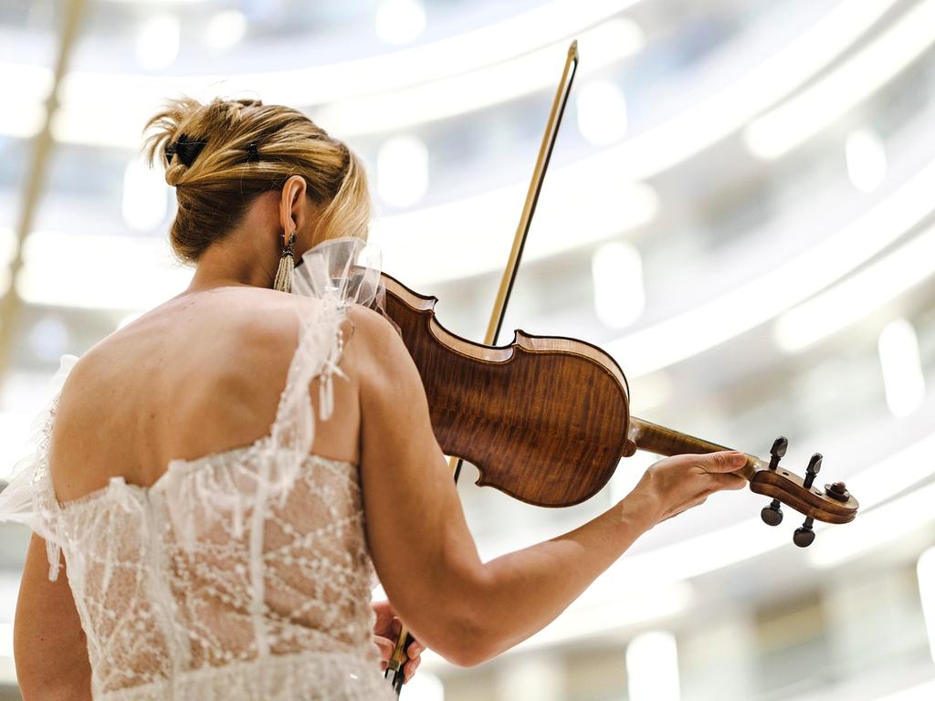 Violinist Elena Martinez performing with passion